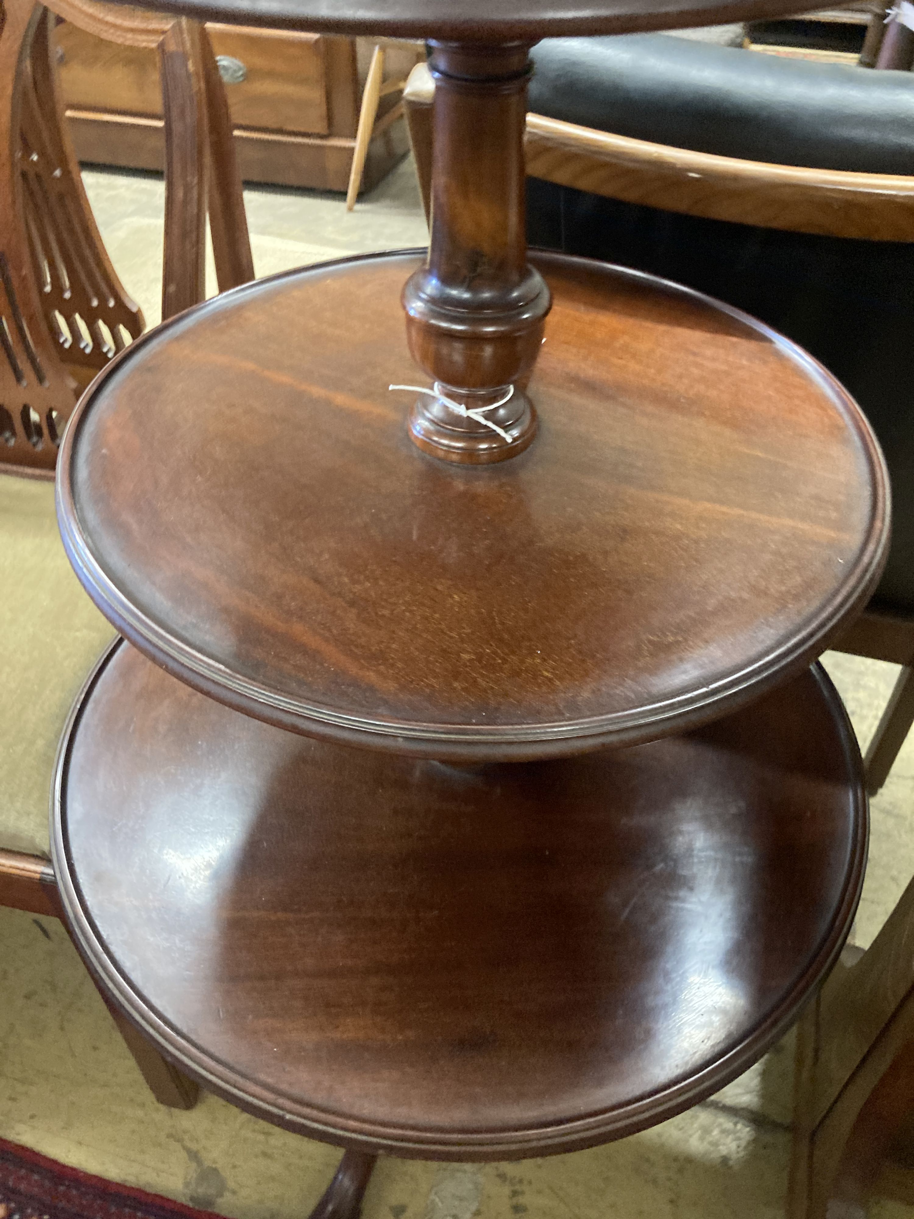 A Georgian mahogany revolving three tier dumb waiter, height 100cm